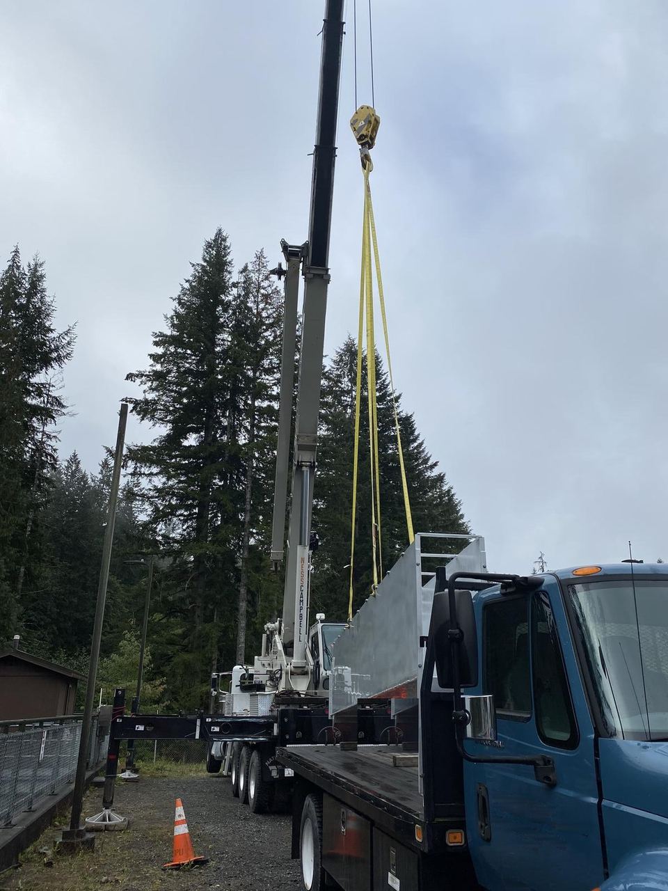 Crane lifting a fabricated metal component